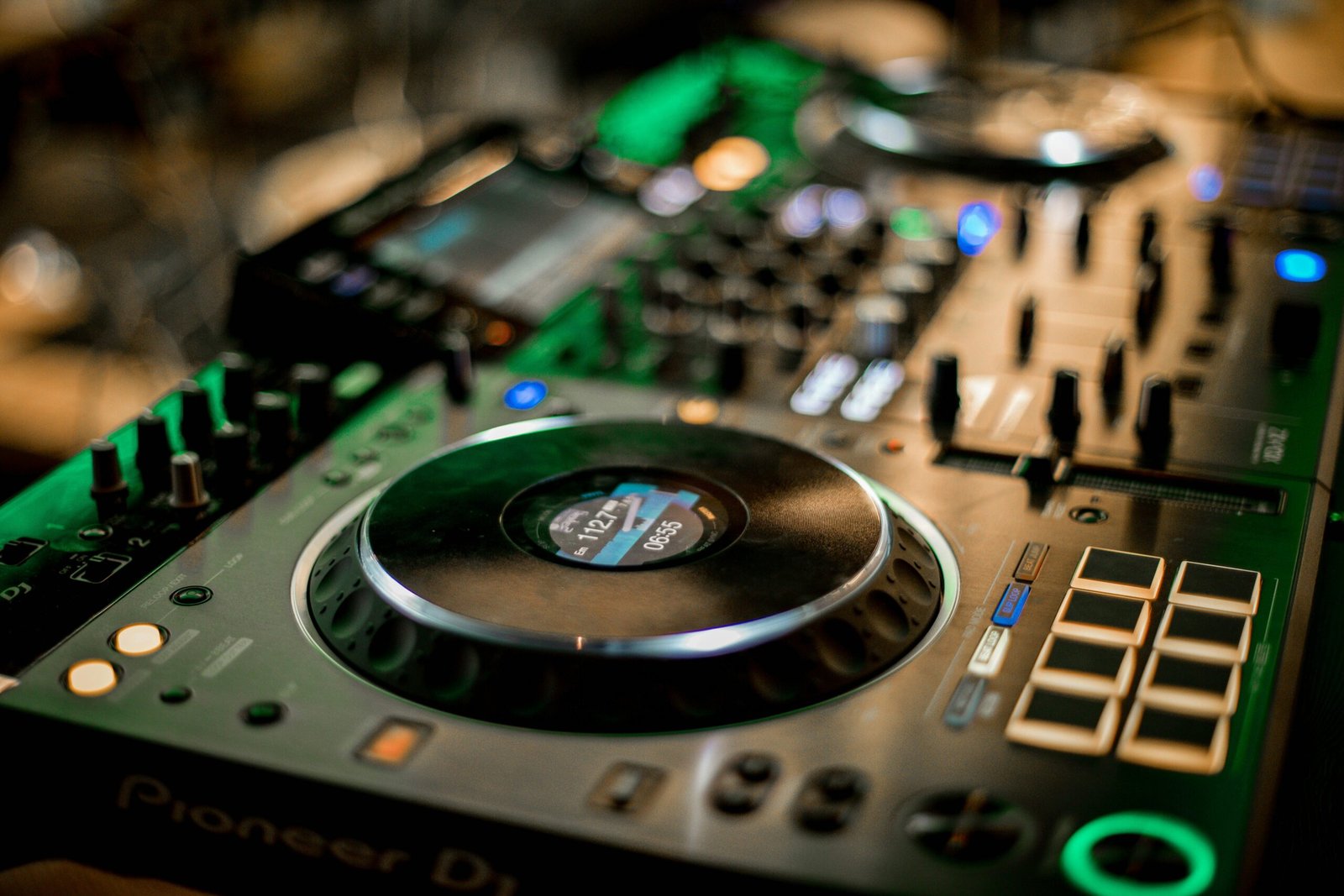 Selective focus of glowing music controller for music mixing and turntables on console